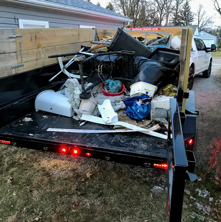 Roll-off dumpster delivered to a residential driveway in Sandy